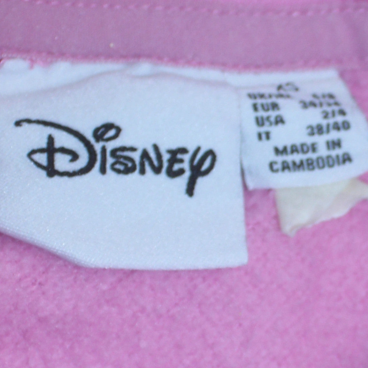 Close-up detail of Disney women’s pink minnie mouse pullover hoodie, size UK 10, casual