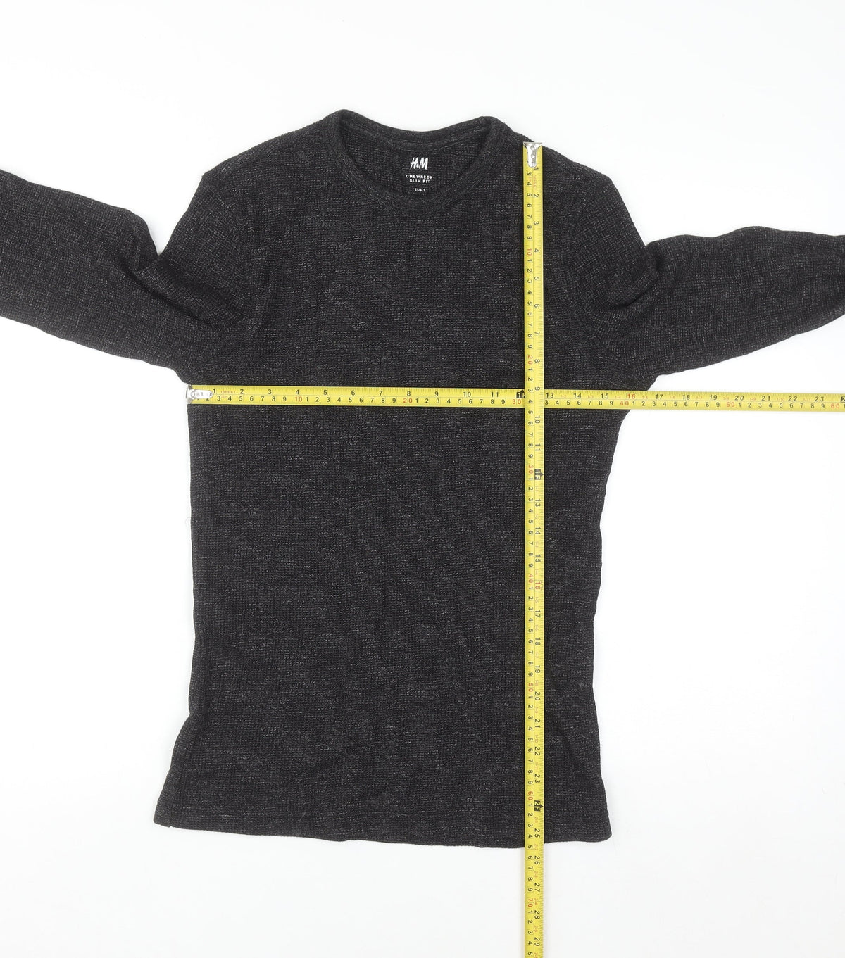 Close-up detail of H&M Men’s Black Slim Fit Crew Neck Long Sleeve Jumper, size S