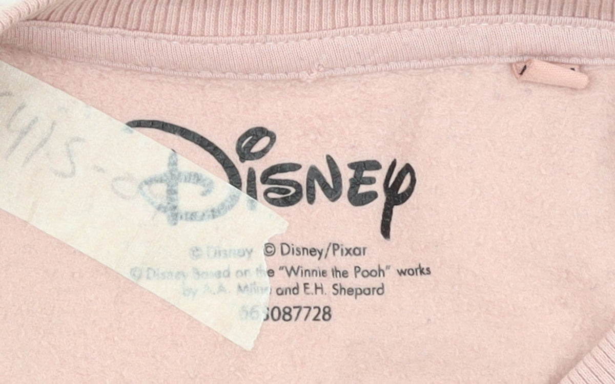 Brand and care label for Disney Women Pink Minnie Mouse Graphic Pullover Sweatshirt, size 10, M
