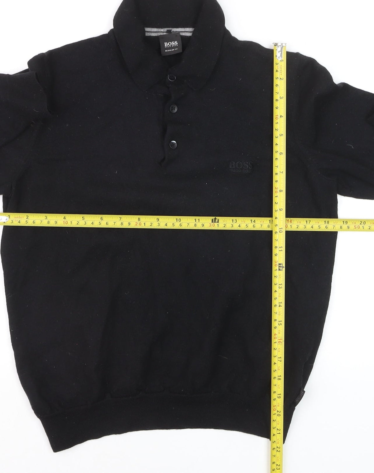 Close-up detail of Hugo Boss men’s black collared henley jumper, size L, regular fit