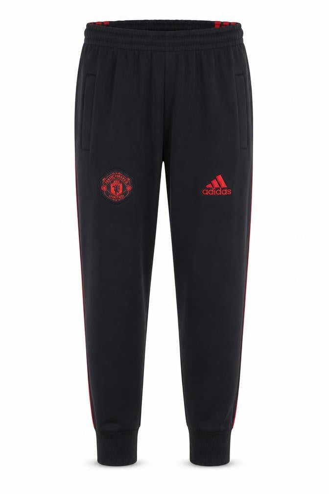 Front view of Adidas boys’ black manchester united joggers 14 years football activewear