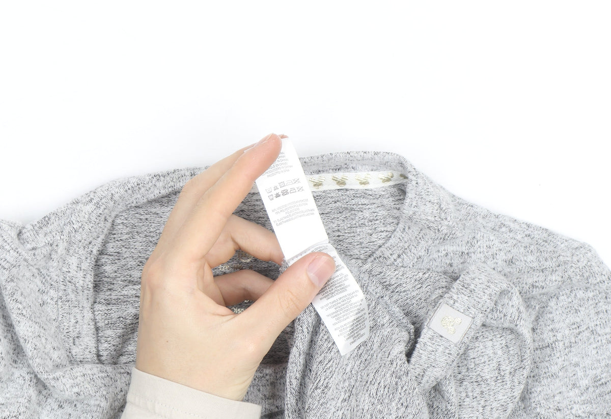 Brand and care label for Disney Women’s Grey Mickey Mouse jumper, size UK 10