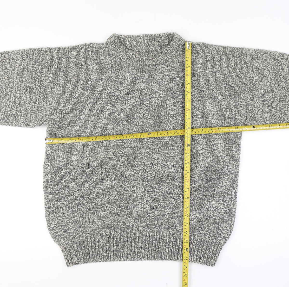 Close-up detail of men’s grey vintage grandad cable knit crew neck long sleeve jumper
