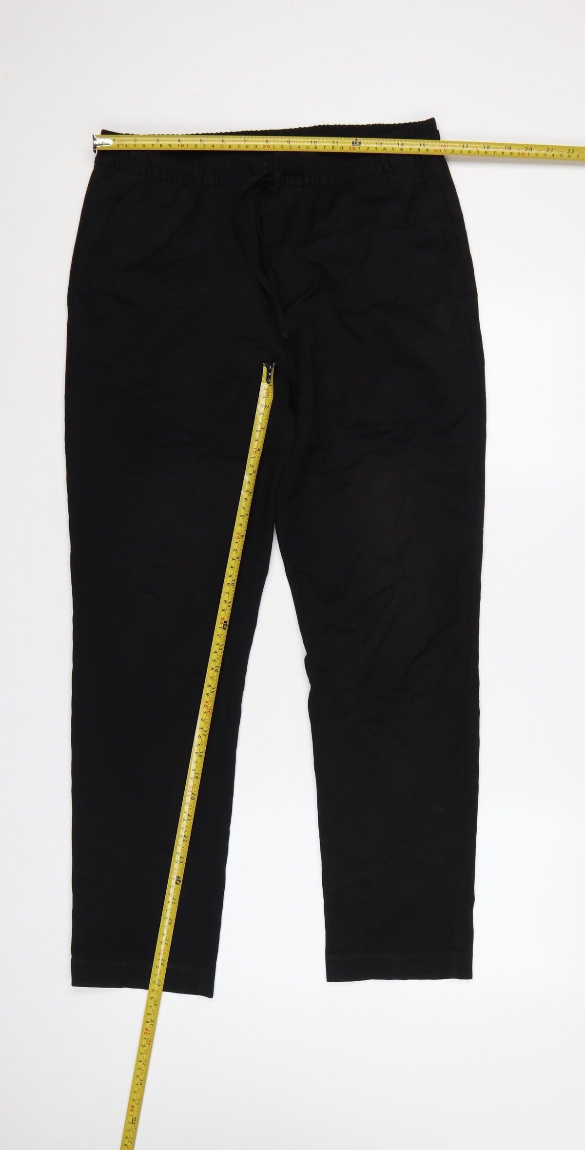 Close-up detail of H&M Men's Black Slim Fit Jogger Trousers, size S, Drawstring