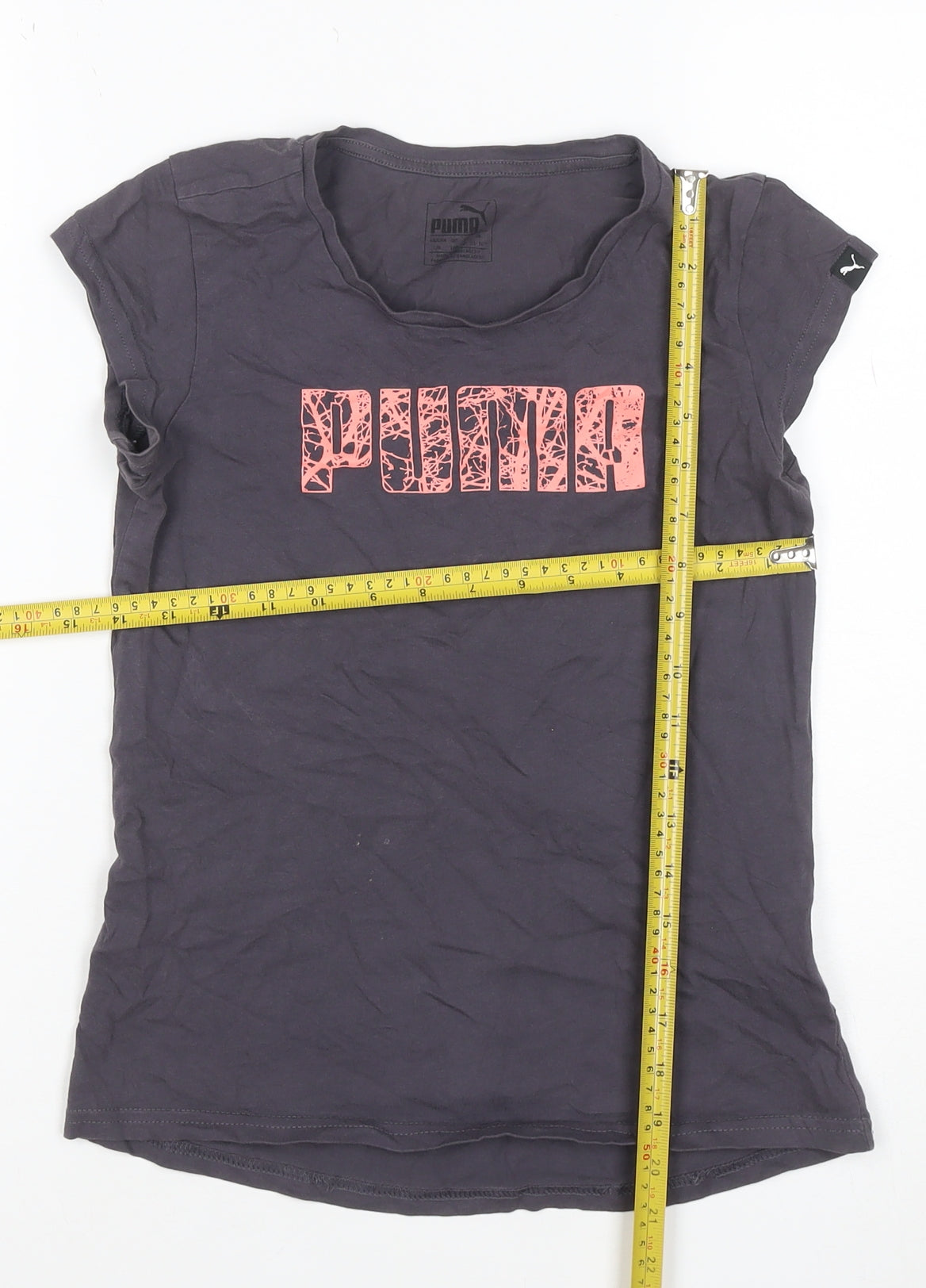 Close-up detail of Puma girls’ grey pink logo graphic t-shirt, size 8, years short sleeve