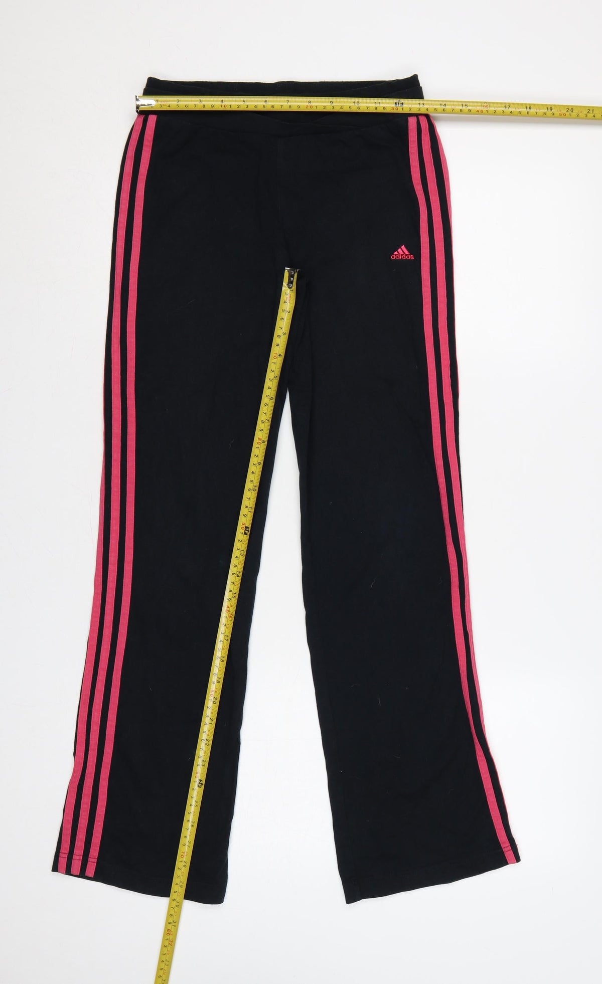 Close-up detail of adidas girls’ black pink 3 stripe sweatpants uk 13-14 years