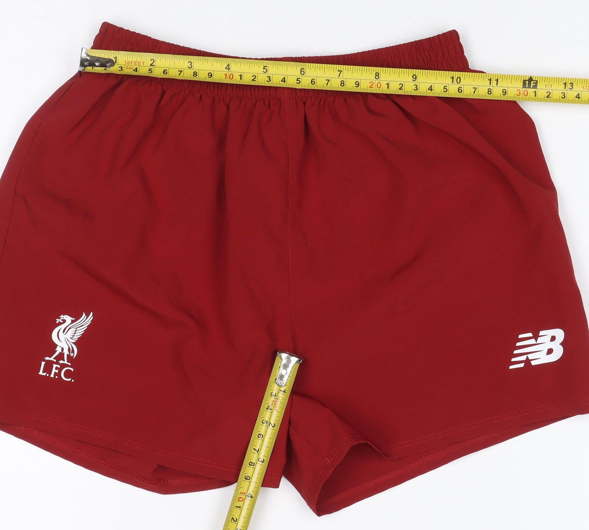 Close-up detail of New Balance boys’ red 6-7 years athletic liverpool fc football shorts