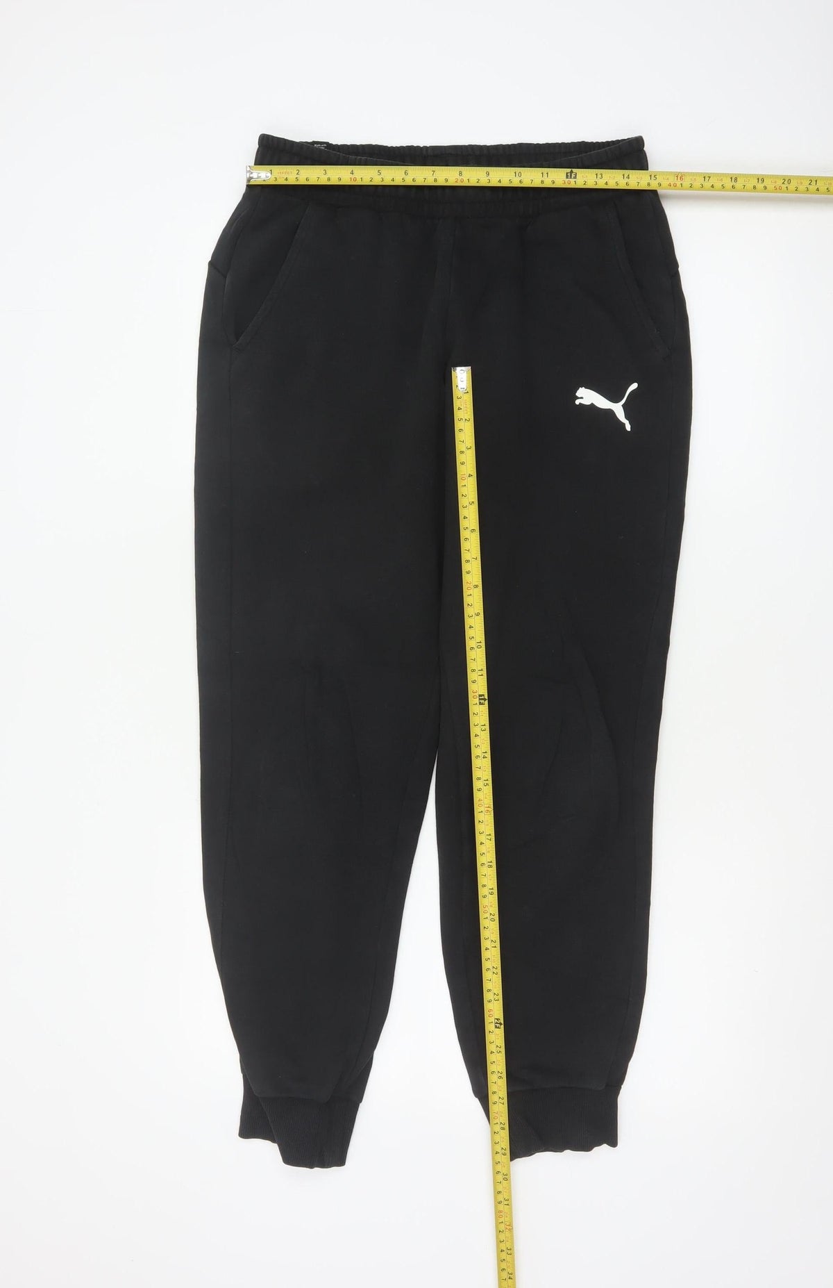 Close-up detail of Puma Men’s Black M Jogger Sweatpants Logo Elastic Waist Cuffed