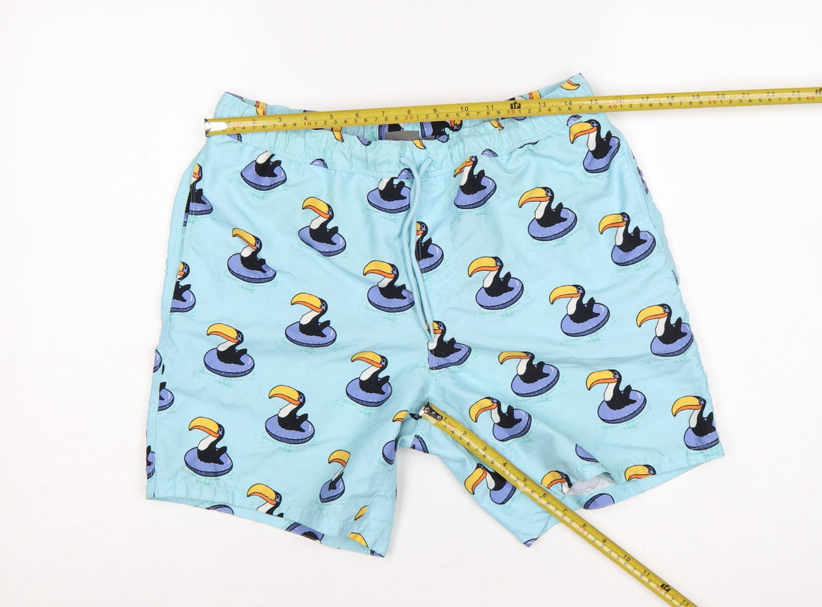 Close-up detail of ASOS Men’s Blue M Toucan Print Drawstring Swim Shorts Mesh Lined