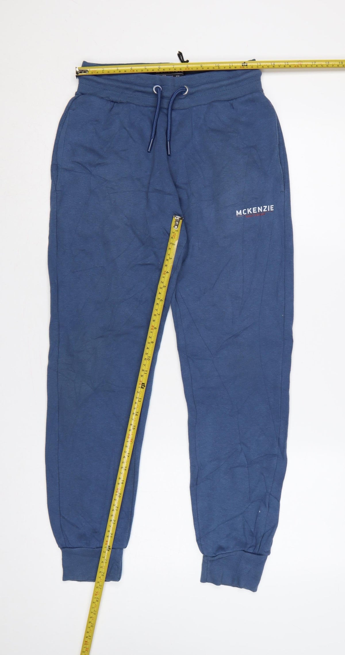 Close-up detail of McKenzie Men’s Blue M Logo Cuffed Drawstring Jogger Sweatpants