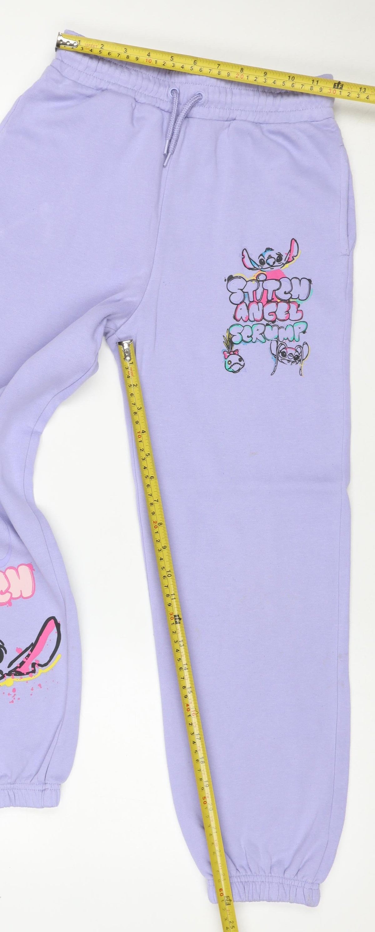 Brand and care label for Primark Disney Stitch girls’ purple sweatpants 11-12 years jogger
