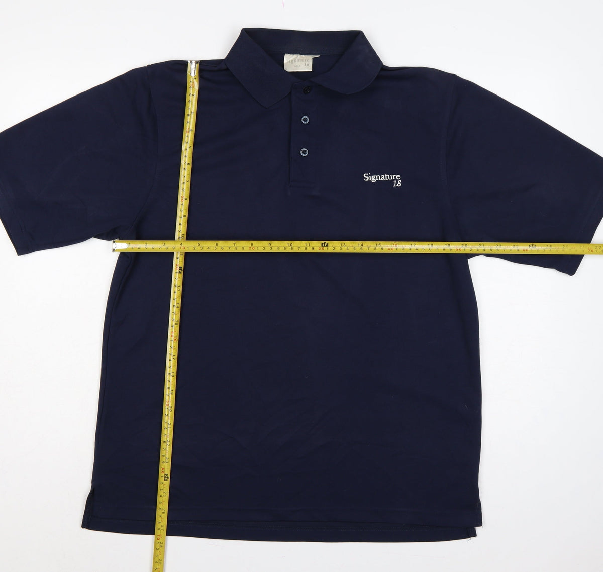 Close-up detail of Signature Golf 18 Men's Blue M Short Sleeve Embroidered Logo Polo Shirt