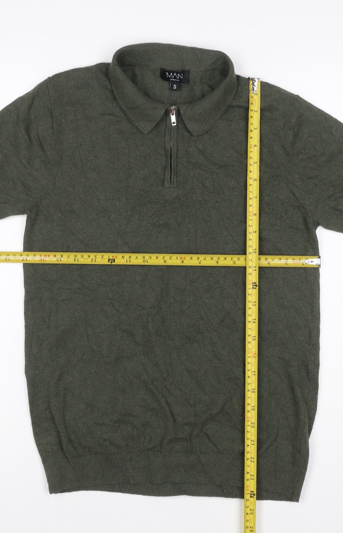 Brand and care label for boohooMAN Men’s Green, size S, Knit 1/4 Zip Short Sleeve Polo