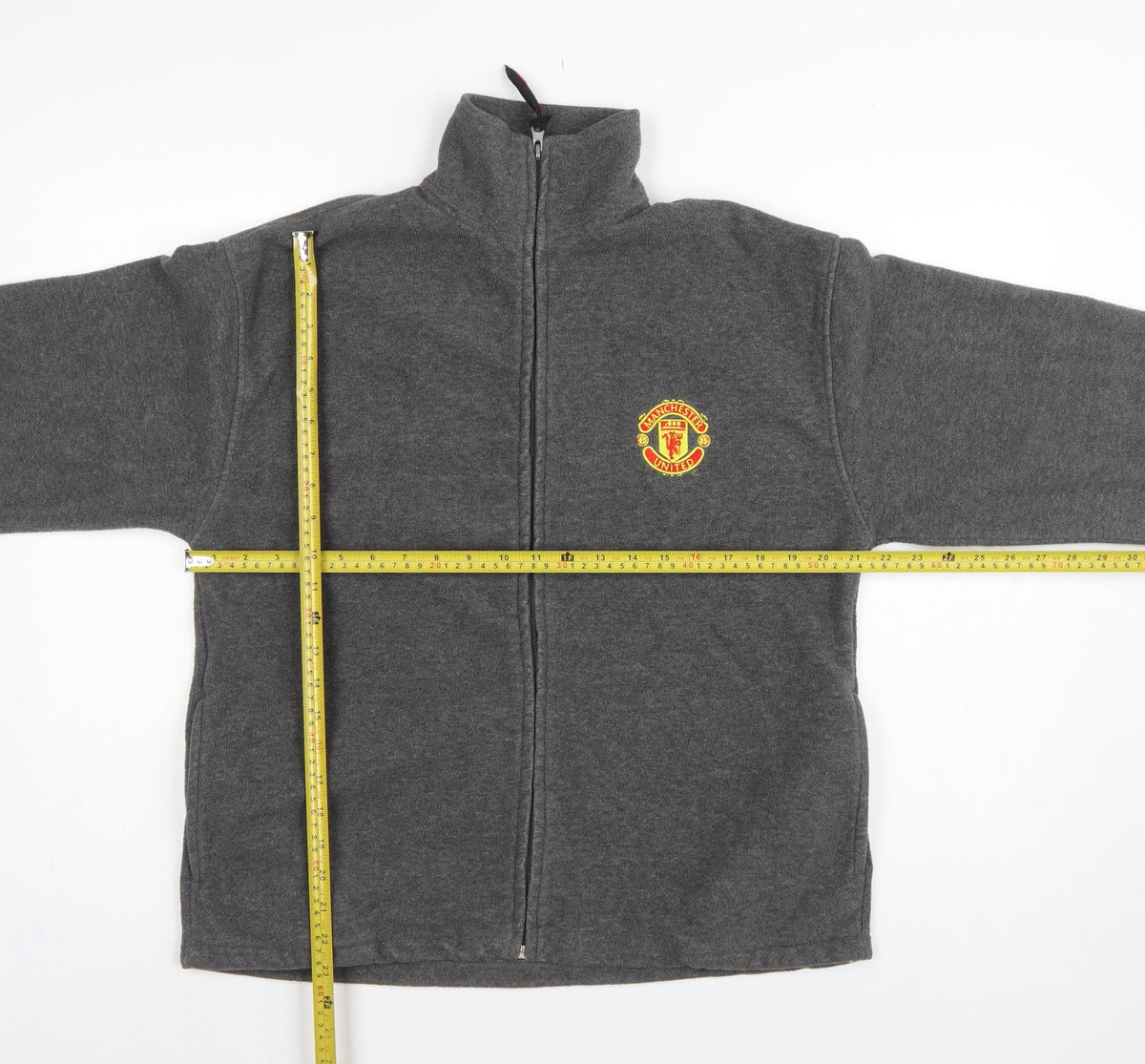 Close-up detail of Manchester United Men’s Grey S Fleece Full Zip Football Jacket