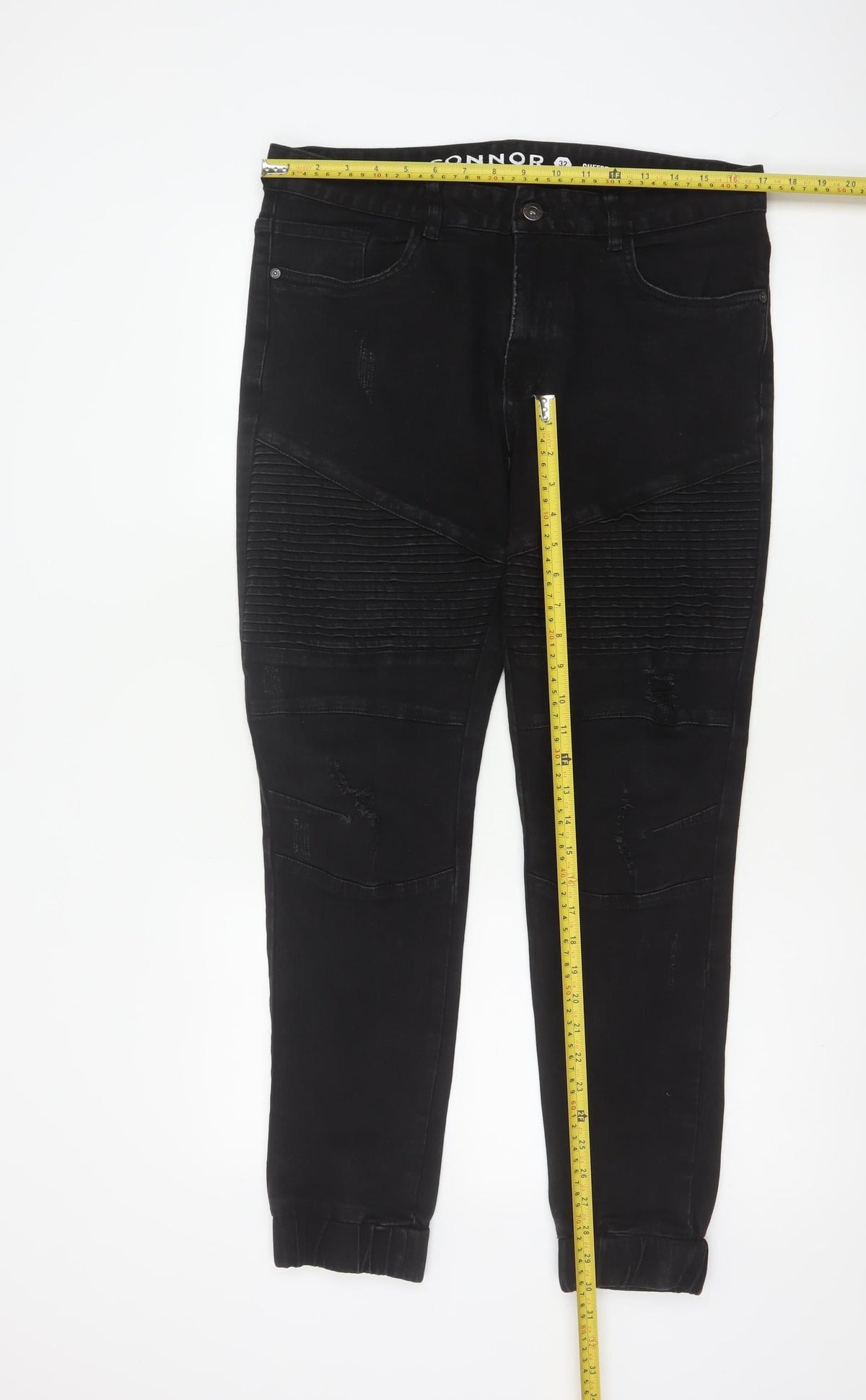 Close-up detail of Connor Men’s Black 32 Skinny Cuffed Distressed Biker Jeans