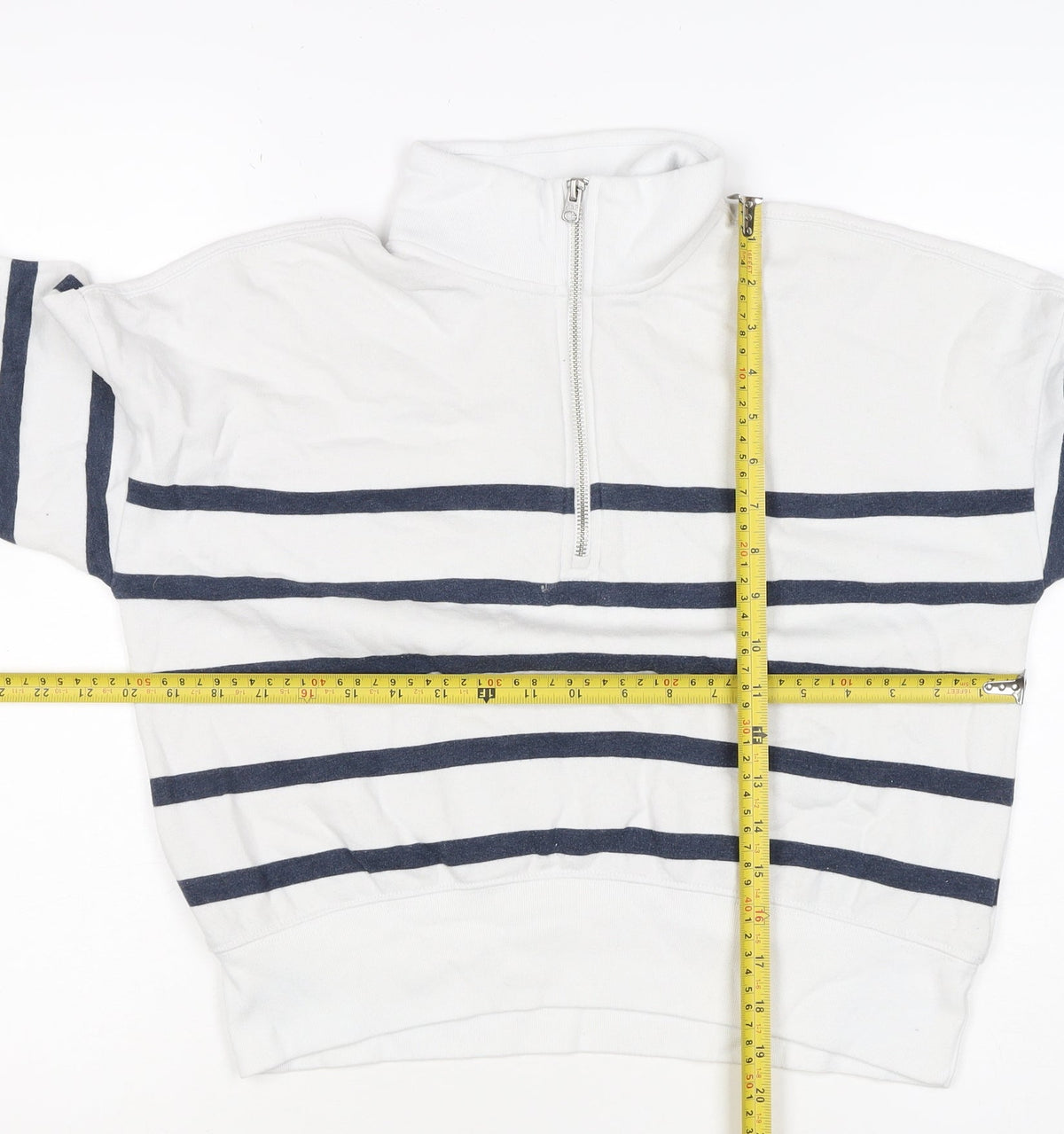 Brand and care label for Abercrombie Kids girls’ white navy striped 13-14 years 1/4 zip sweatshirt