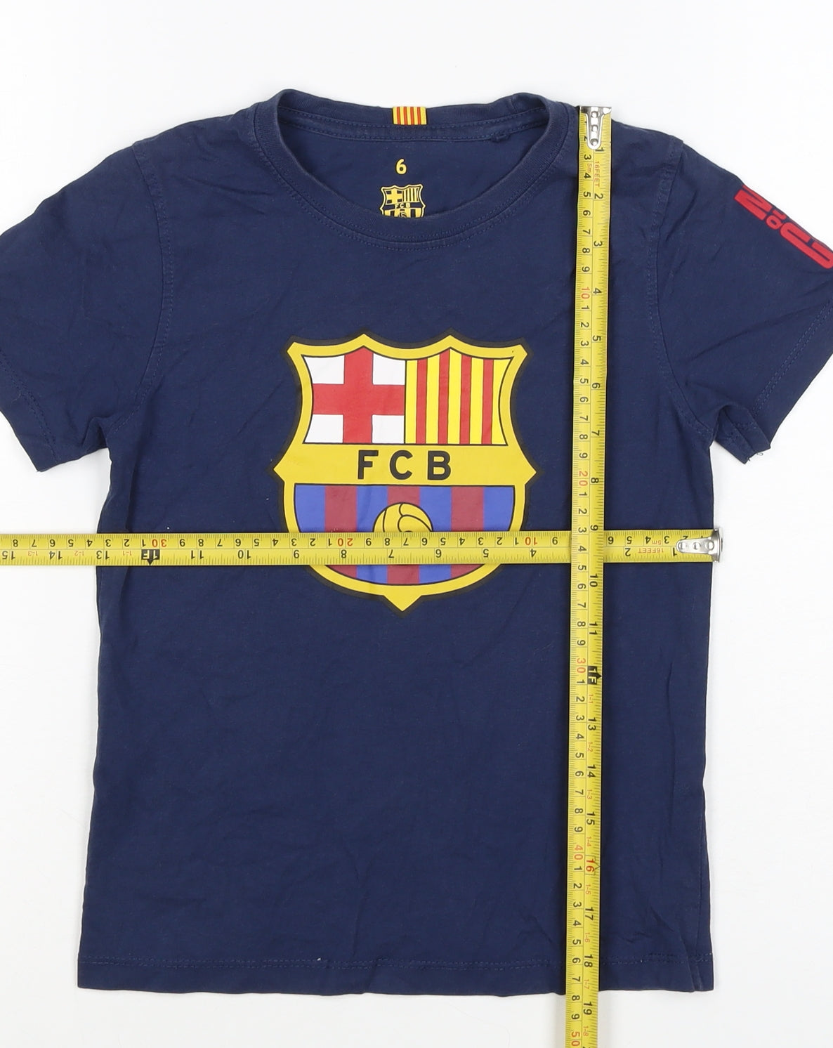 Brand and care label for FC Barcelona boys’ blue 6 years logo football graphic t-shirt
