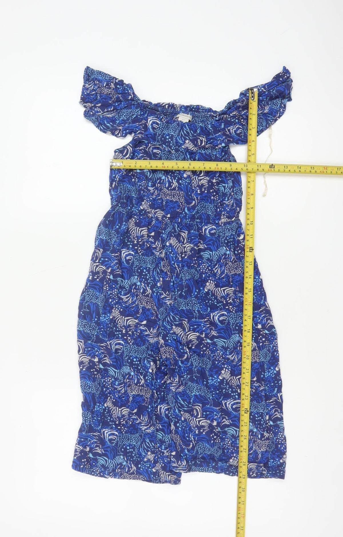 Close-up detail of Monsoon girls’ blue 5-6 years animal print off shoulder wide leg jumpsuit