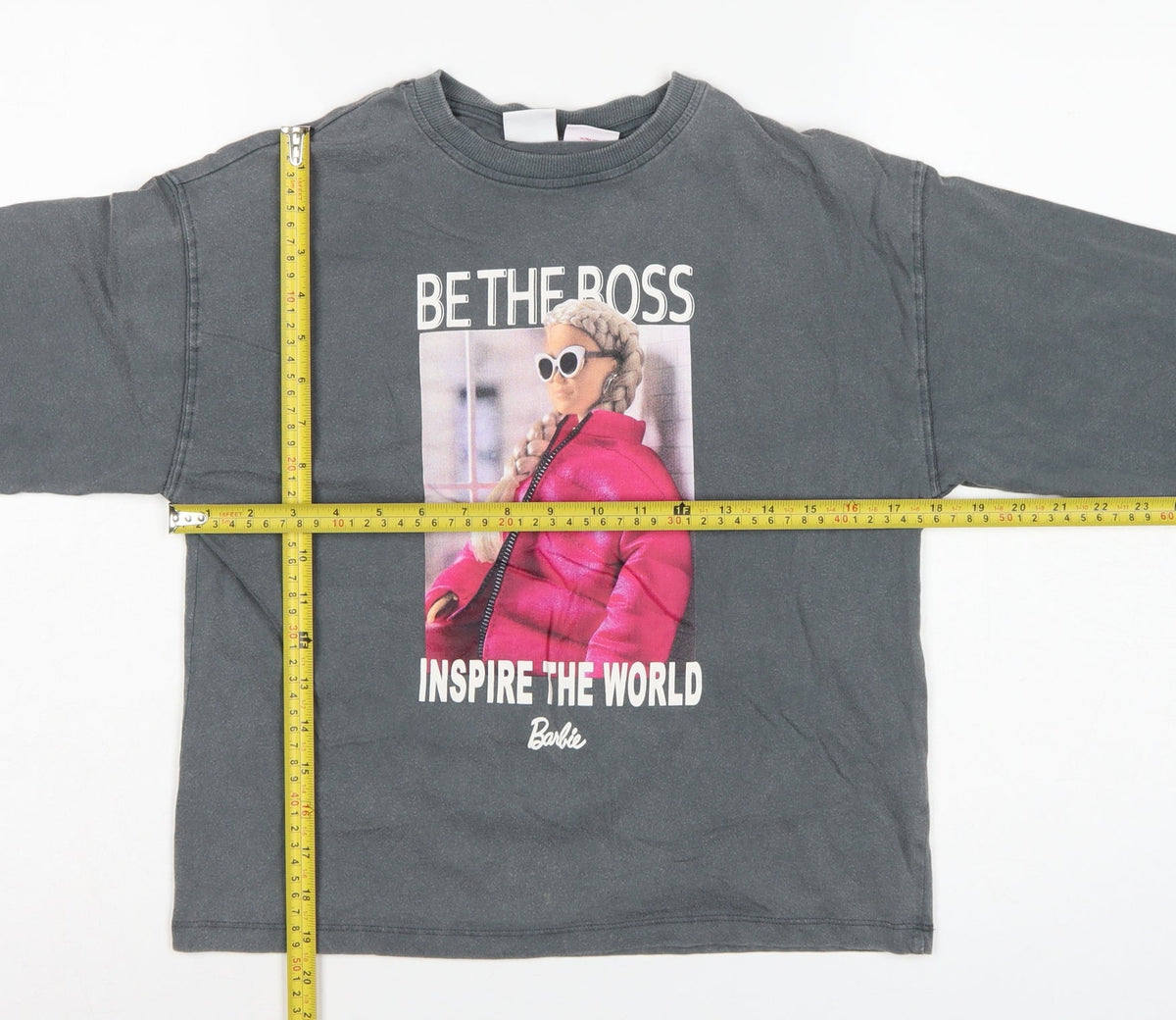 Close-up detail of Zara girls’ grey barbie graphic long sleeve t-shirt 9-10 years